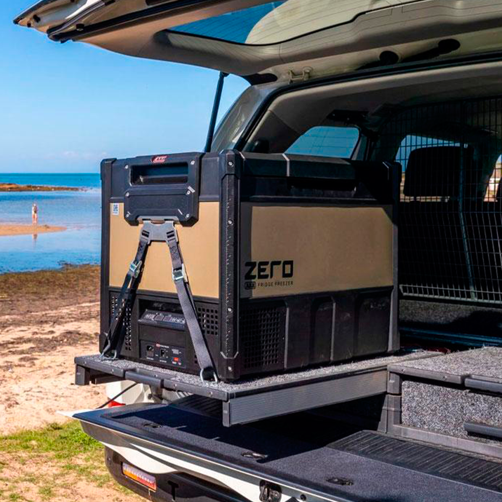 A durable SUV with versatile cargo capacity features an ARB Zero 73 Quart Dual Zone Portable Fridge Freezer 10802692 in the trunk.