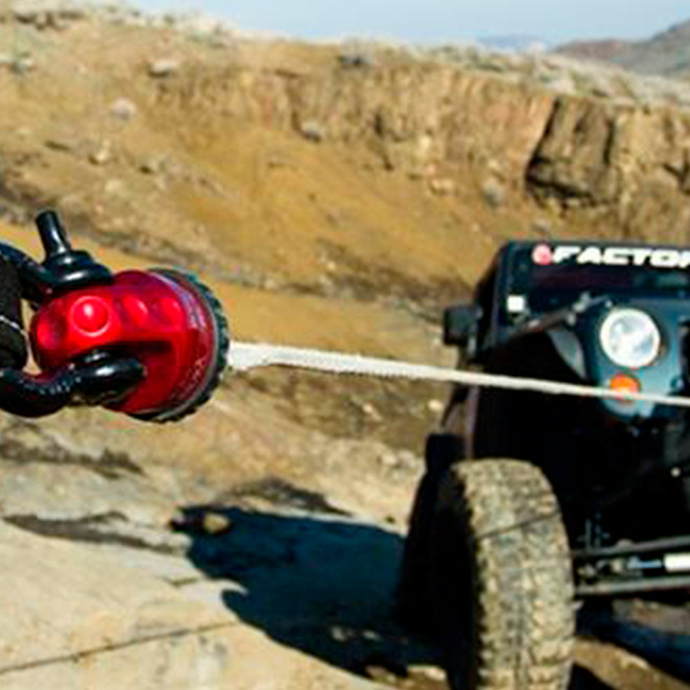 A jeep with a Factor 55 ProLink XXL Shackle Mount Assembly in Red 00210-01 attached to it.