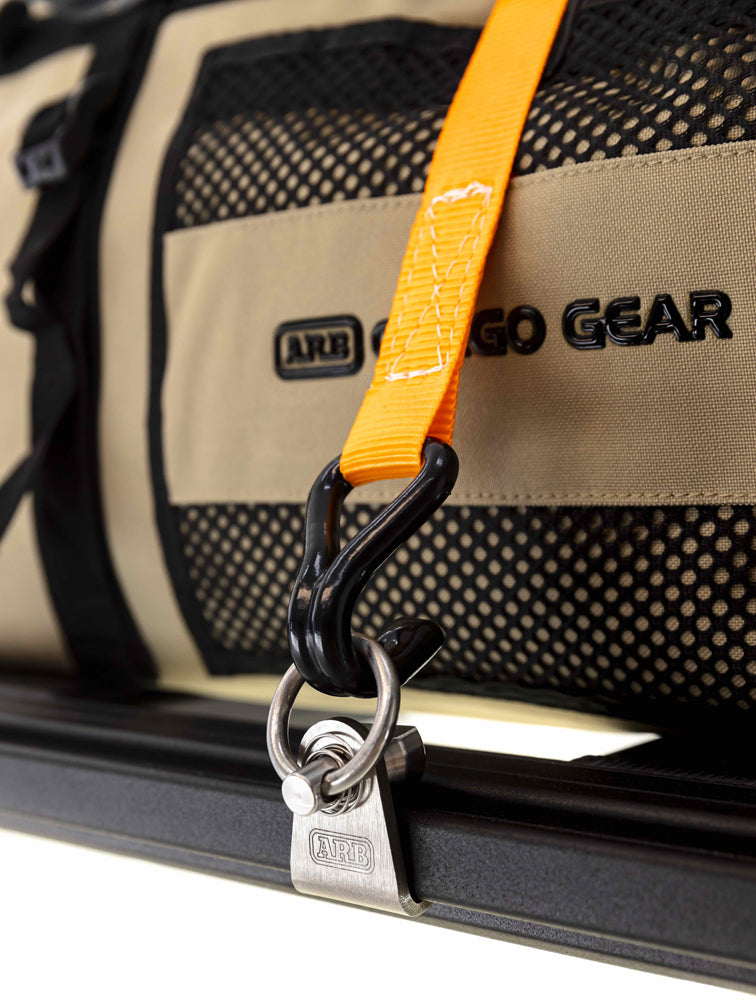 A lockable bag enhanced with ARB Spring-Loaded Tie-Downs (Pair) 1780210 for secure attachment to the BASE Rack.