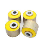 Four yellow Old Man Emu rubber bushings from the 4X4 suspension brand ARB, on a white background.