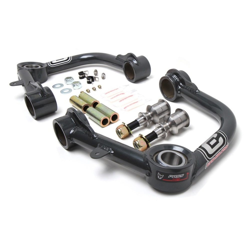 A set of Camburg 1.25" Uniball Upper Control Arms CAM-310036 for Toyota 4Runner, FJ Cruiser, Tacoma sway bars with ball joints for enhanced wheel travel and upper arms.