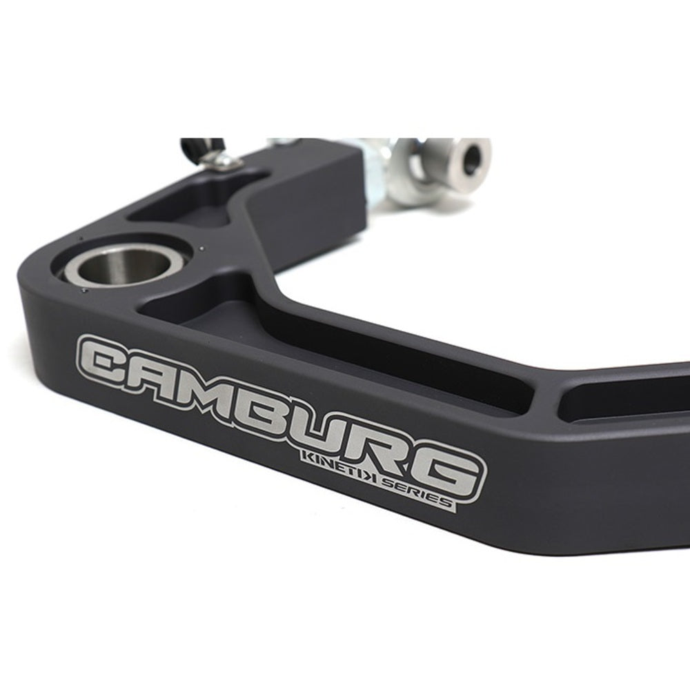 The Camburg Kinetik Billet Uniball Upper Control Arms for Toyota Tacoma, 4Runner front suspension bracket, featuring adjustable camber and caster, is displayed on a white background.