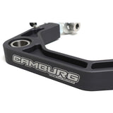 The Camburg Kinetik Billet Uniball Upper Control Arms for Toyota Tacoma, 4Runner front suspension bracket, featuring adjustable camber and caster, is displayed on a white background.