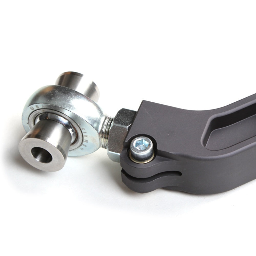 A Camburg Kinetik Billet Uniball Upper Control Arms for Toyota Tacoma, 4Runner handlebar clamp with an adjustable camber and caster bolt on it.