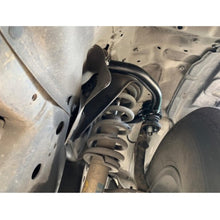 Load image into Gallery viewer, A Freedom Off-Road Front Upper Control Arms for Toyota 4Runner, FJ Cruiser, Lexus GX460 &amp; GX470 equipped with a suspension system, including control arms and ball joints for enhanced stability and maneuverability.