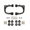 A pair of Fabtech Uniball Upper Control Arms for Toyota Tacoma 2015-ON and bolts on a white background.