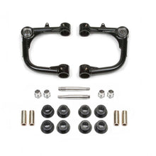 Load image into Gallery viewer, A pair of Fabtech Uniball Upper Control Arms for Toyota Tacoma 2015-ON and bolts on a white background.