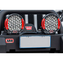 Load image into Gallery viewer, A jeep with an ARB Intensity Solis Lighting Kit + Wiring Loom (SPOT/SPOT) SJB36S / SJBHARN adjustable bracket for two lights on the front bumper.