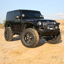 Load image into Gallery viewer, An enhanced black Fox Racing Jeep Wrangler JK 07-18 2 Door with a FOX 2 inch Lift Kit (Medium Load) parked on a dirt road.