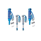 A set of King Shocks with blue damping characteristics and springs on a white background.