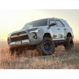 The 2019 Toyota 4Runner, equipped with exceptional off-road performance and the KING 0 - 2 inch Leveling Kit for 4Runner (10-23) by King Shocks, is peacefully parked in a field.
