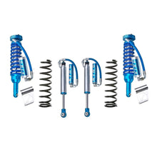 Load image into Gallery viewer, A set of blue King Shocks with outstanding off-road performance and exceptional damping characteristics, showcased on a pristine white background.