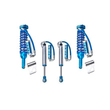 Load image into Gallery viewer, A set of blue King Shocks on a white background, exhibiting off-road performance and suspension articulation.