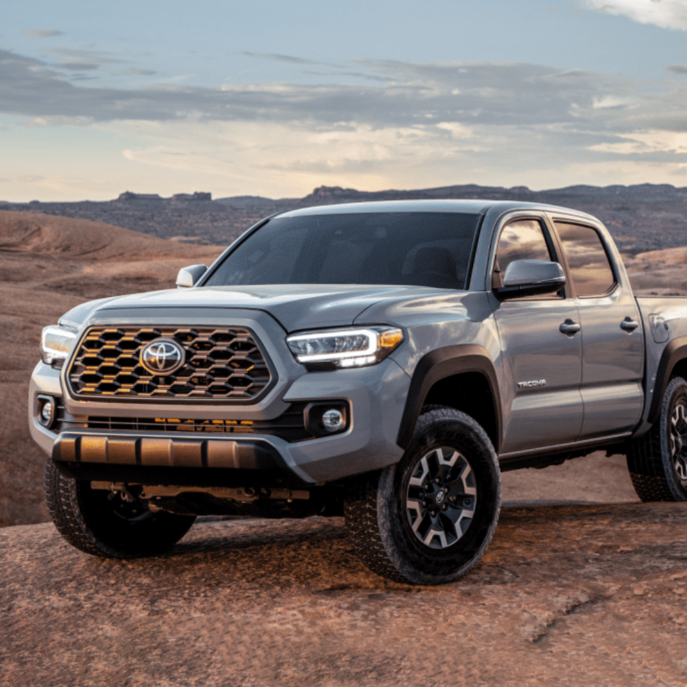 The KING 2 - 3 inch Lift Kit for Tacoma (05-23) from King Shocks, with its off-road performance capabilities and enhanced stability, is showcased in the captivating desert landscape.