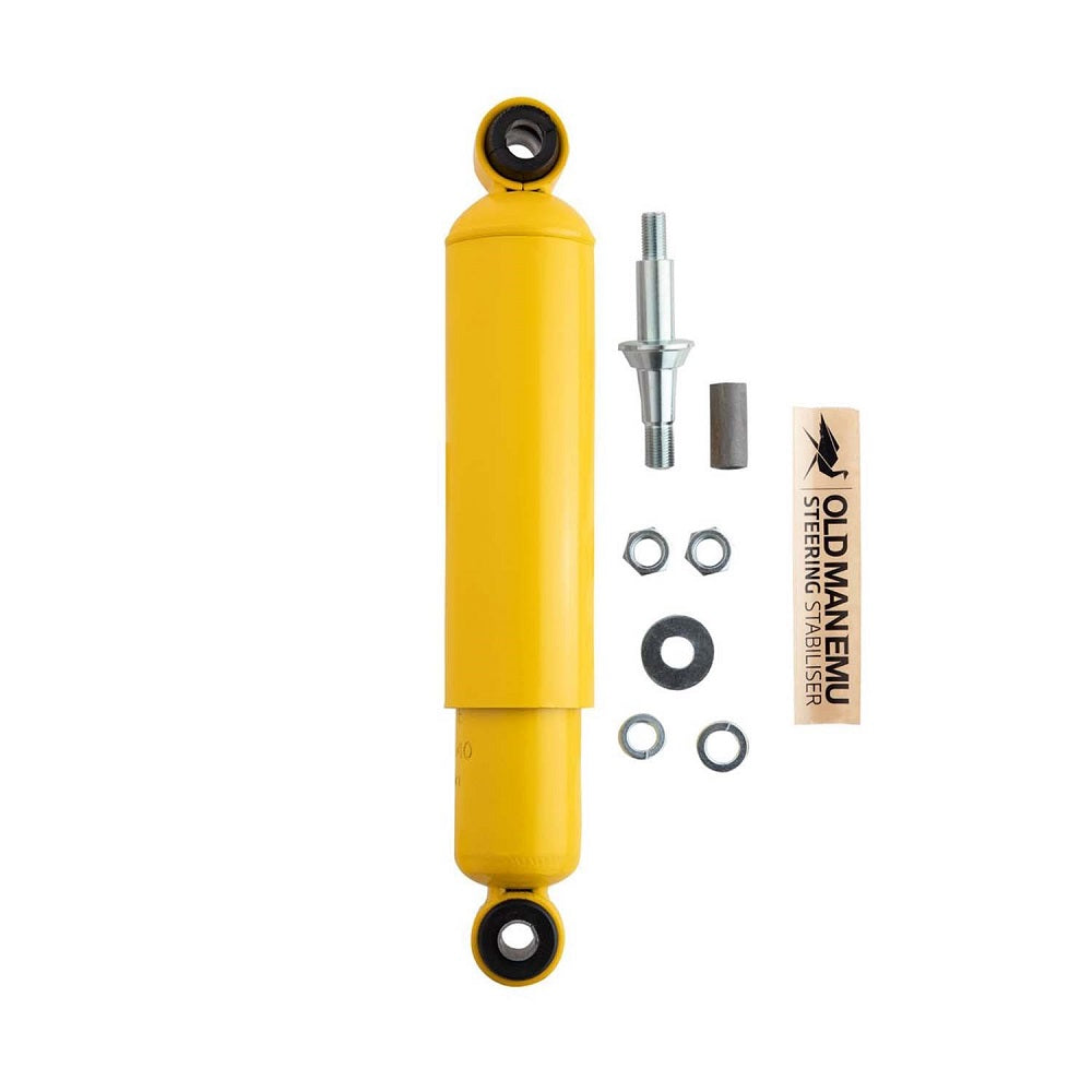 An ARB Old Man Emu Steering Stabilizer OMESD40 for Jeep Wrangler TJ 97-06, Wrangler LJ 03-06 suspension upgrade featuring a yellow shock absorber with a bolt and nut.