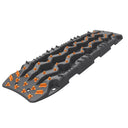 An image of a black and orange ARB TRED Pro Recovery Boards TREDPROMGO stair tread, providing enhanced traction in Australia.