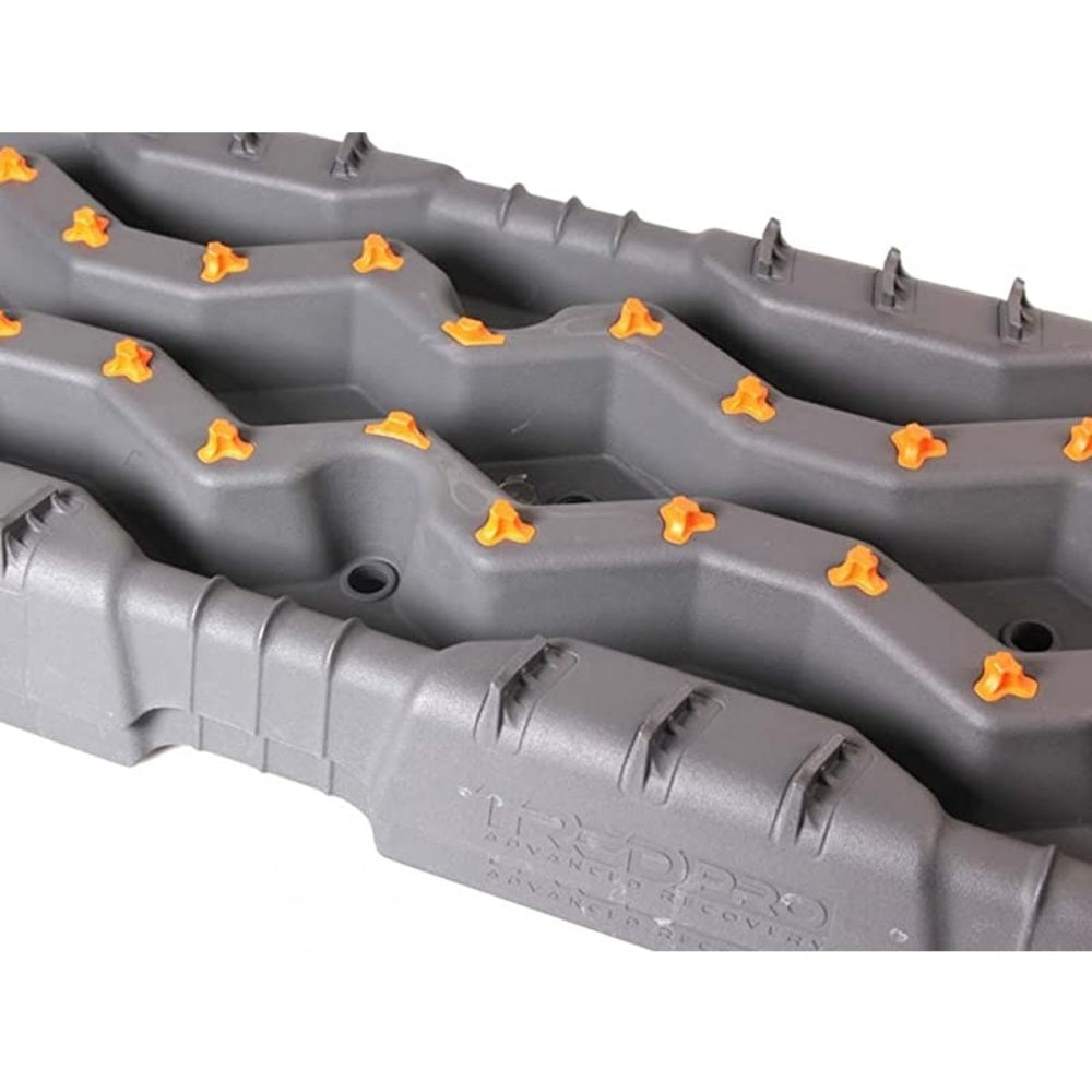 An ARB TRED Pro Recovery Boards TREDPROMGO - Gray/Orange tray with ARB studs on it for enhanced traction.