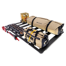 Load image into Gallery viewer, An ARB Base Rack (49&quot; x 45&quot;) 1770060 outfitted with several bags and secured by CROSSBARS.