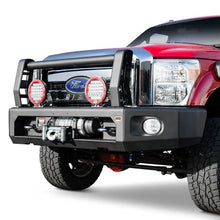 Load image into Gallery viewer, A red Ford F-250 pickup truck with an ARB Sahara Style Modular Winch Bumper Kit (2236020) and secure mounting points on a white background.