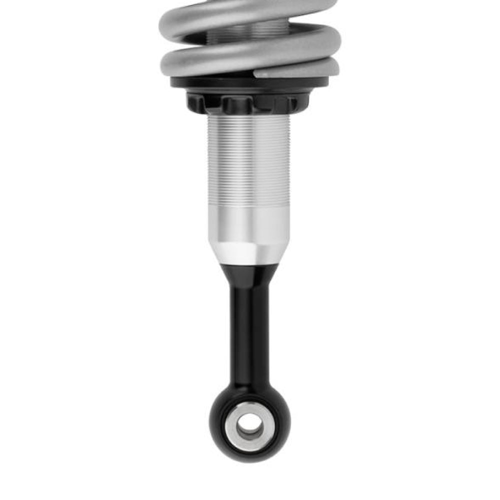 A black and silver FOX 2.0 Performance Series 2.0 Front Coil-Over IFP Shock 985-02-002 for Toyota Tacoma 4WD and RWD/ 4Runner / FJ Cruiser / Land Cruiser Prado 120 (Pair) on a white background, rust resistant, from the brand Fox Racing.