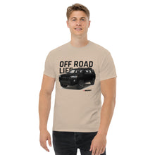 Load image into Gallery viewer, A trendy man wearing a Mudify 4Runner Life Classic Tee with a structured look that says off road light.