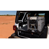 ARB Classic Series II 82 Quarts Portable Fridge Freezer Electric Powered 12V/110V 10801782 secured in rear cargo of off-road SUV
