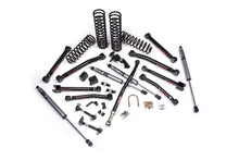 Load image into Gallery viewer, A JKS 2.5 Inch Jeep Wrangler JK (06-18) 2 Door J-Krawl Lift Kit for a jeep wrangler that includes coil springs and gas shocks.