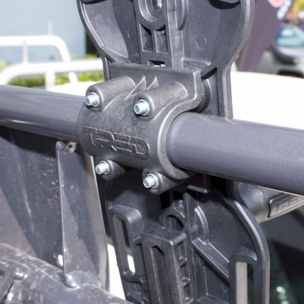 An image of a vehicle with a metal bar attached to it, featuring an ARB Mount Adapter TRED TPMKBA01.