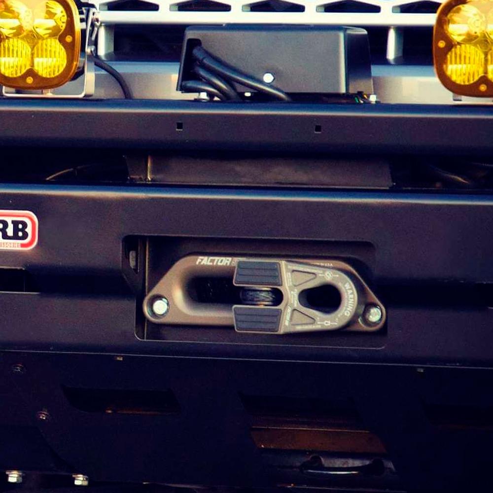 A close up of a high-quality bumper with Factor 55 Hawse Offset Fairlead 1.5 in 00026 lights on it.