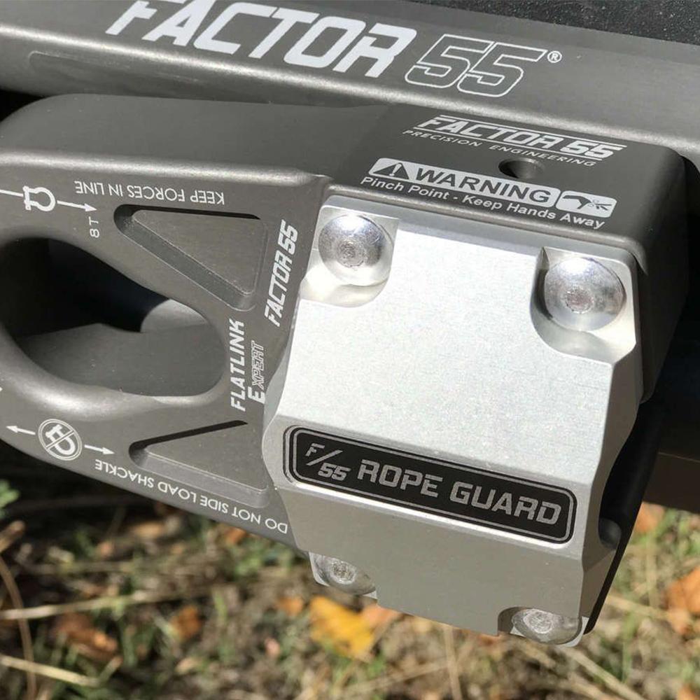 A motorcycle with a Factor 55 FlatLink Rope Guard 00380 attached to the handlebars featuring an UltraHook for enhanced visibility.