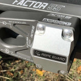 A motorcycle with a Factor 55 FlatLink Rope Guard 00380 attached to the handlebars featuring an UltraHook for enhanced visibility.