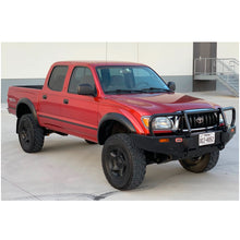 Load image into Gallery viewer, A red Old Man Emu Toyota Tacoma parked in a parking lot.