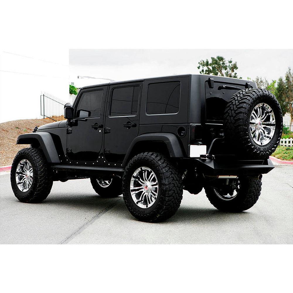 A black jeep wrangler with Old Man Emu Rear Fitting Kit FK37 is parked in a parking lot, ensuring superior ride quality and shock absorber performance.