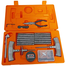 Load image into Gallery viewer, An ARB Speedy Seal Tire Repair Kit Series II 10000011 with various tools in an orange case, including tire repair tools.