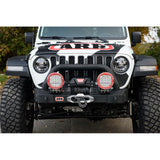 ARB Old Man Emu Rear Fitting Kit FK37 mounted on front bumper of 4x4 Jeep Wrangler JL with off-road lighting and winch installation