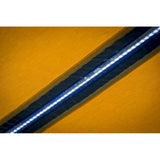 An image of the ARB Awning LED light strip on a yellow background, showcasing its bright lumens.