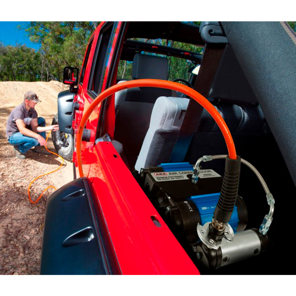 An ARB jeep wrangler with a CKMTA12 Bundle Kit - ARB Inflation Kit, Air Compressor and Digital Tire inflator attached to it.