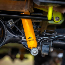 Load image into Gallery viewer, The rear suspension of a Jeep Wrangler utilizes the ARB Old Man Emu Rear Nitrocharger Sport 60155 for Suzuki Jimny (4th Gen) 4 Cylinder 1.5L Petrol Engine All Models and features compression valving by Old Man Emu.
