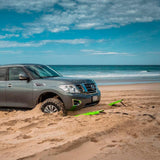 Nissan Armada on the beach with surfboards, equipped with ARB TRED TL1500 leashes for vehicle recovery.