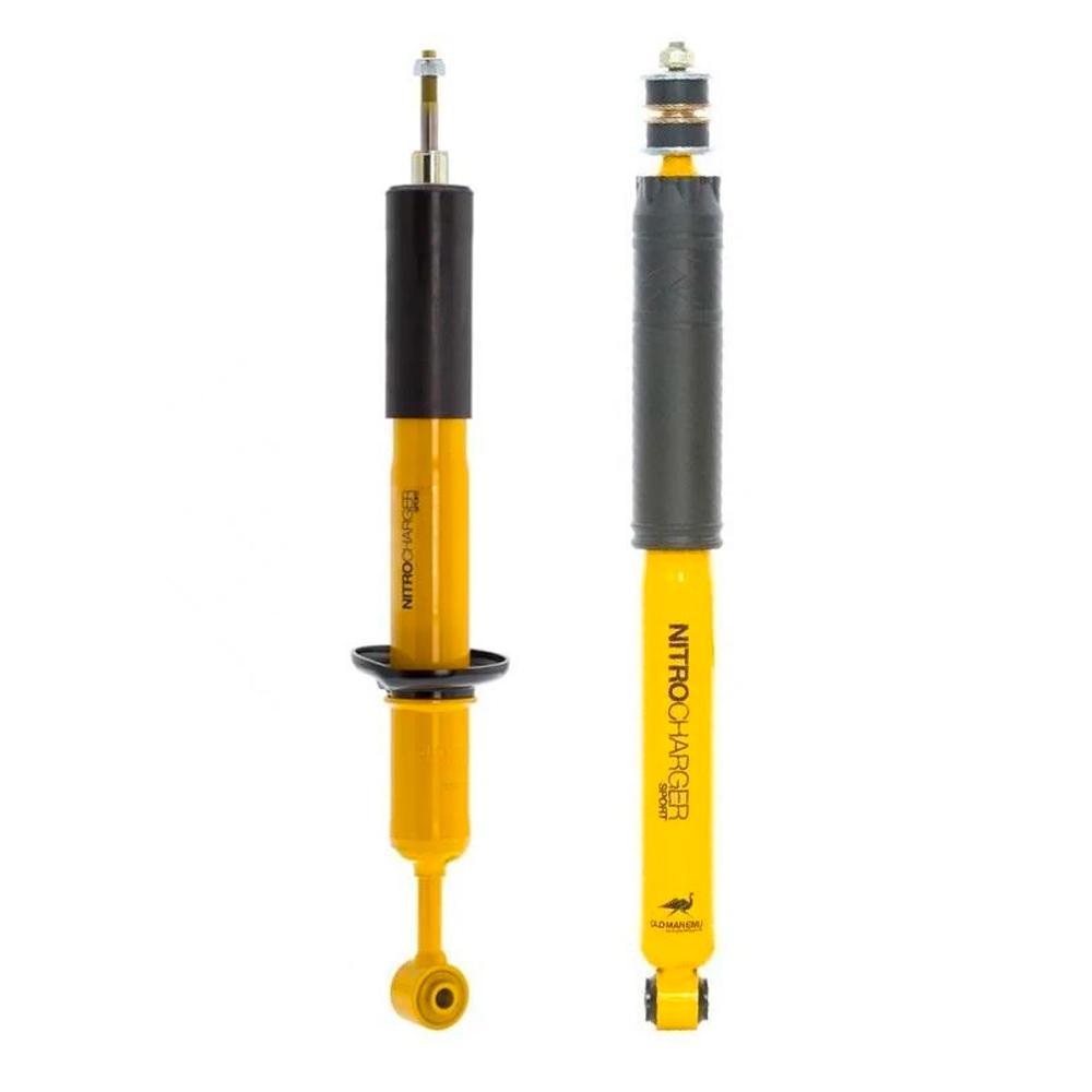 A pair of yellow Old Man Emu shock absorbers featuring high-quality oil, on a white background.