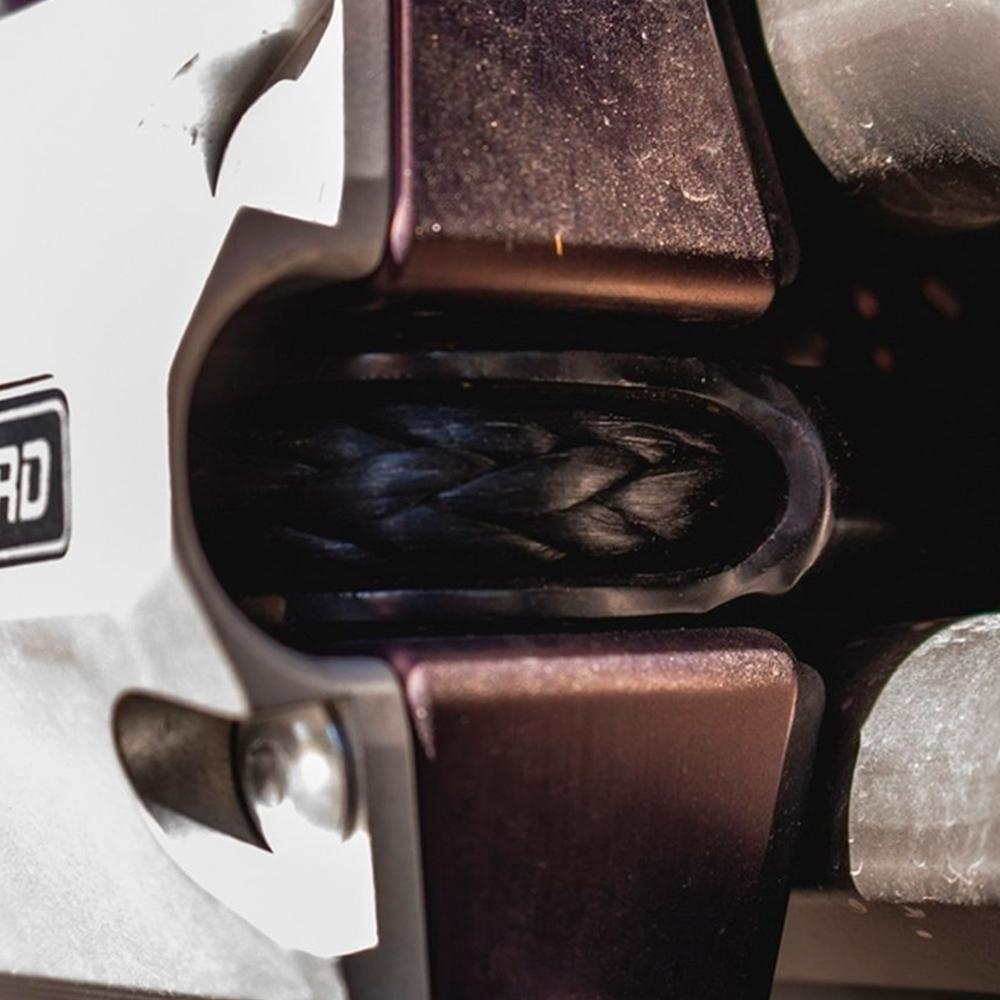 A close up of a Factor 55 UltraHook Winch Shackle Aluminum 00250-06 attached to a motorcycle.