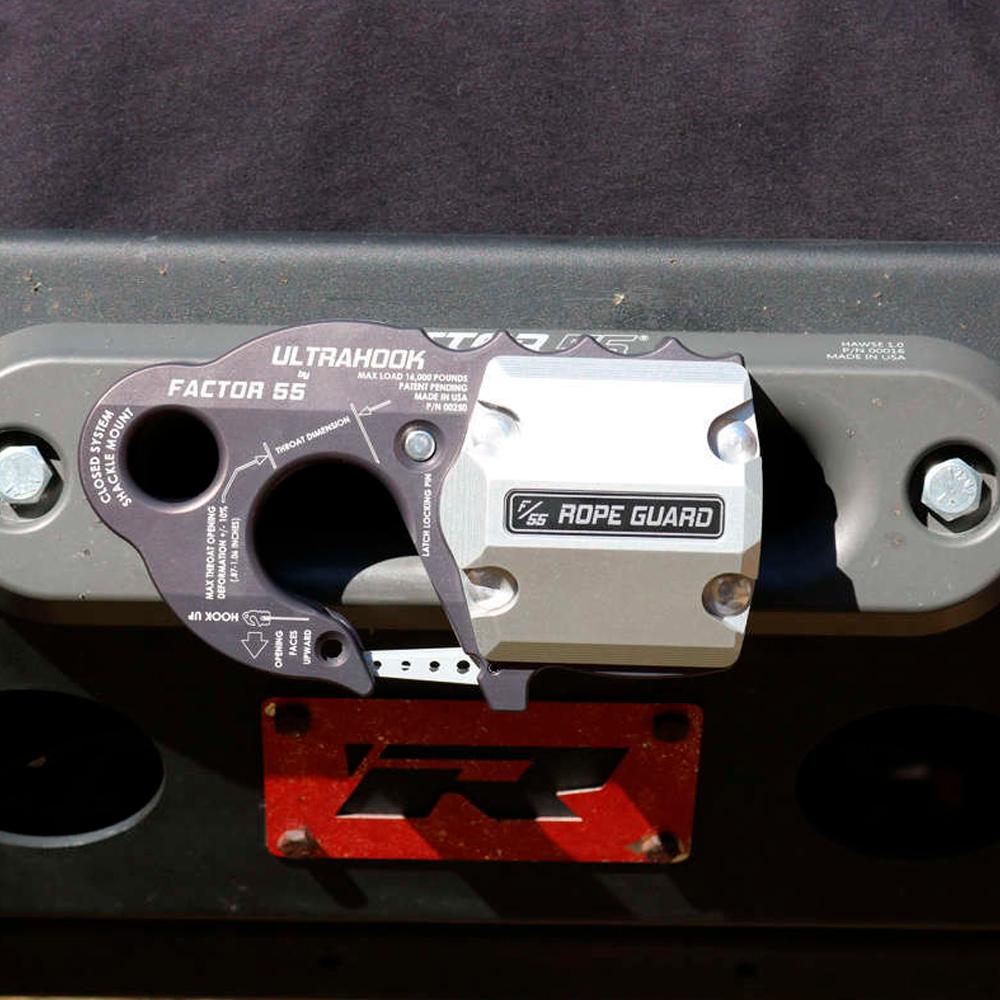 A Factor 55 FlatLink XXL Rope Guard 00384 is attached to the side of a truck for added synthetic rope protection.