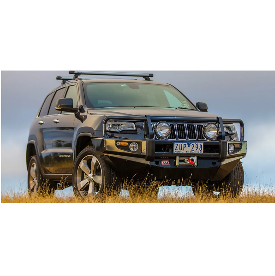 The Old Man Emu Jeep Grand Cherokee, known for its easy installation and reliable ARB Old Man Emu Rear Coil Springs 2944 suspension system, is conveniently parked in a field. Additionally, this vehicle boasts excellent oxidation protection to ensure longevity and durability.
