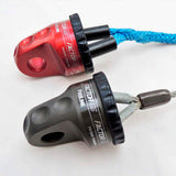 Two Factor 55 Shackle Mounts in Gray 00015-04, one red and one blue, laid out on a white surface.