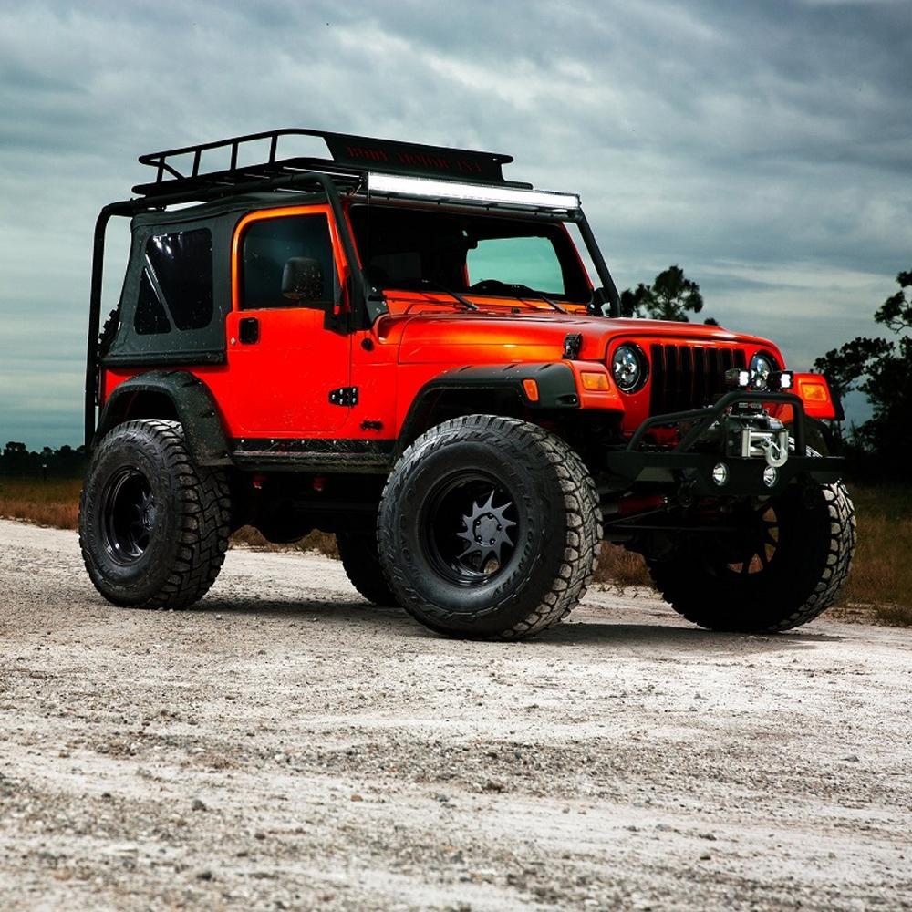 An orange jeep is parked on a dirt road next to an ARB RD105 Air Locker Differential Dana 35 with 30 Splines.