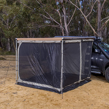 Load image into Gallery viewer, A car is parked next to a tent with ARB Deluxe Awning Room With Floor 813108A for weather protection.