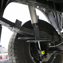 Load image into Gallery viewer, A close up of the suspension system on a Toyota 4Runner featuring the ARB Old Man Emu Leaf Spring U-Bolt OMEU53B components.
