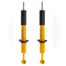Load image into Gallery viewer, A pair of Old Man Emu yellow shock absorbers featuring heavy gauge reserve tubes and high-quality oil on a white background.