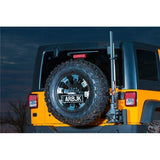 An ARB Rear Tire Carrier For Jeep Wrangler JK ARB 5750320 with a tire carrier mounted on the back of it.