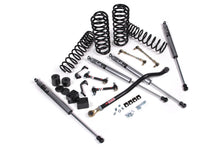 Load image into Gallery viewer, A JKS 2.5 Inch Jeep Wrangler JL (18-ON) 4 Door J-Venture Lift Kit for a jeep with dual rate coil springs and gas shocks, including an installation guide.